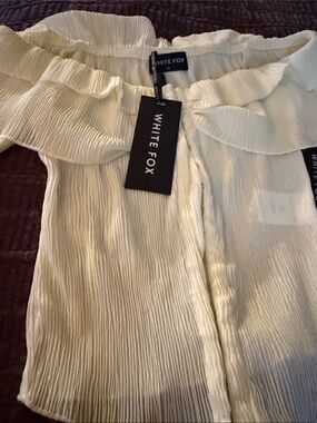 White Fox Boutique Cream Ruffled Off-Shoulder Blouse
